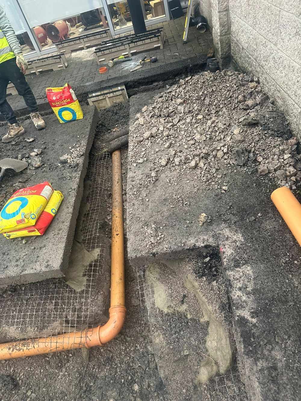 Reinforced concrete foundation with rebar and drainage connection