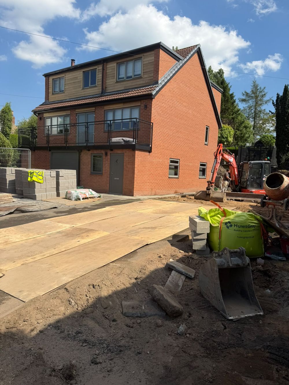 Groundworks in progress on a residential development with excavator