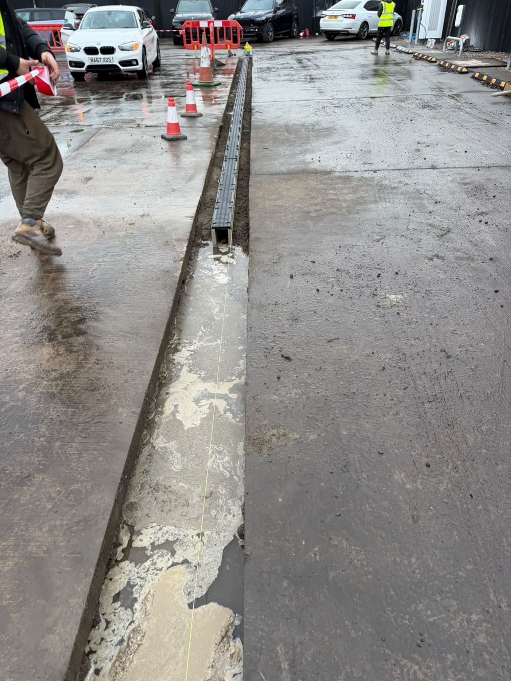 Linear channel drainage set into a concrete access