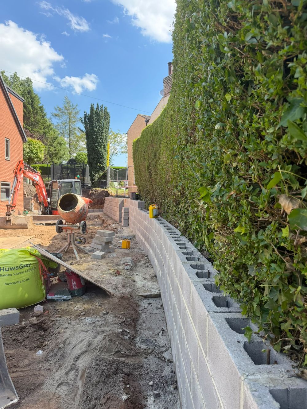 Kerbing and edging installed along a boundary with drainage
