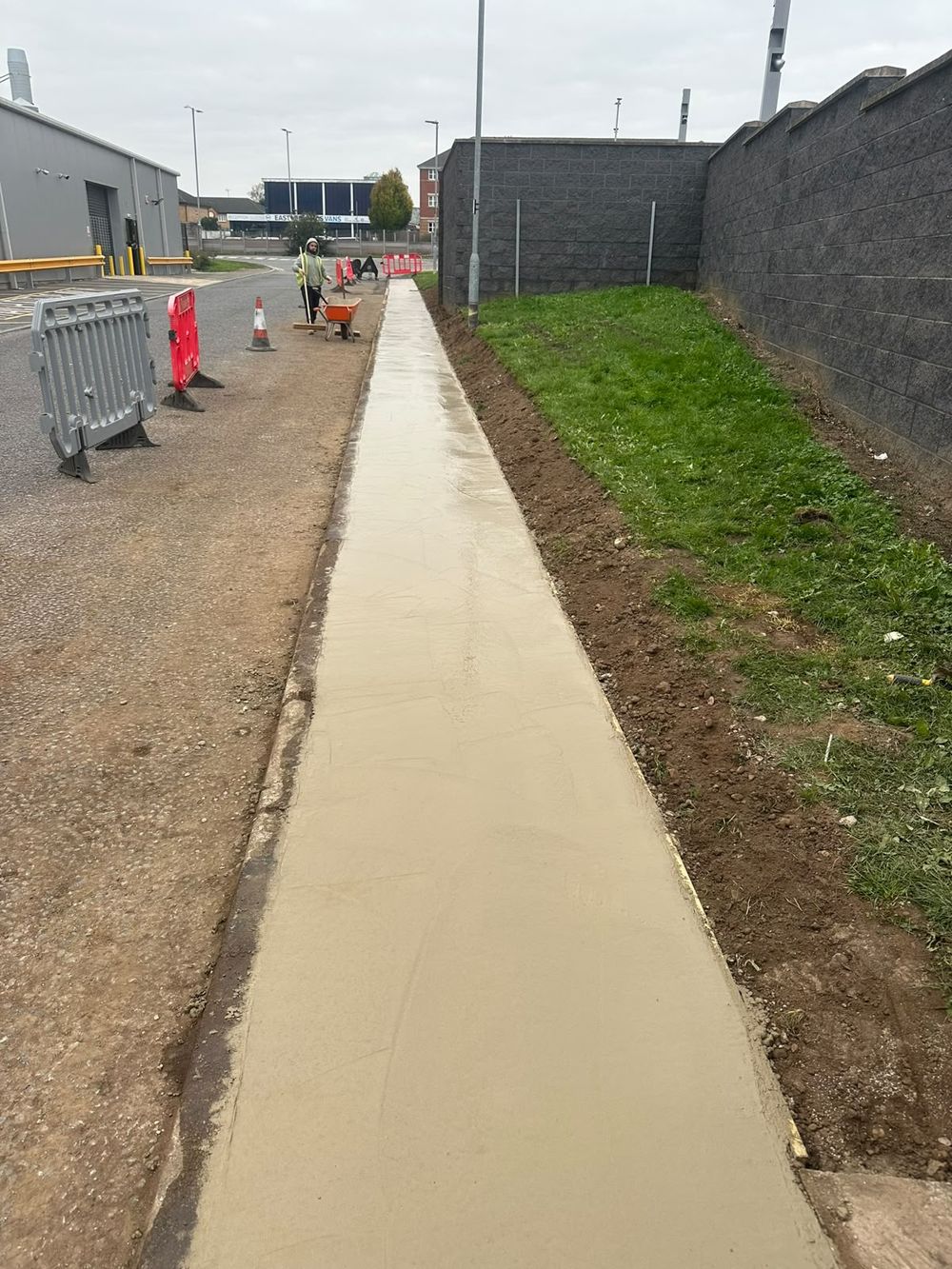 Concrete pathway between turfed areas, completed